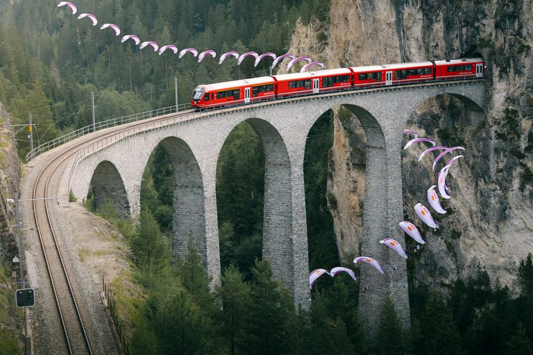 Patrick von Känel Slaloms the Landwasser Viaduct as a Train Crosses Above 